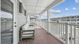 Private covered balcony at a Pointe Grand townhome
