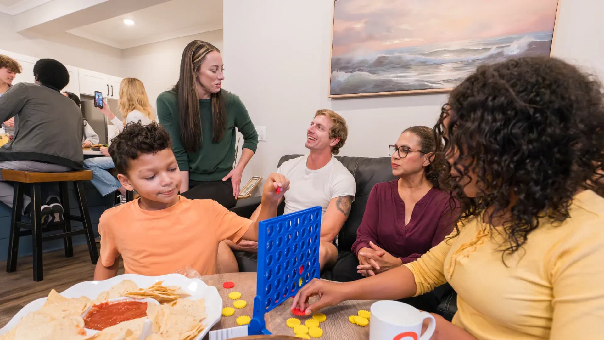 Residents relaxing in a Pointe Grand apartment living room
