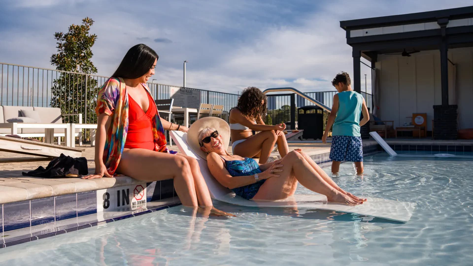 Residents at the pool at a Pointe Grand community