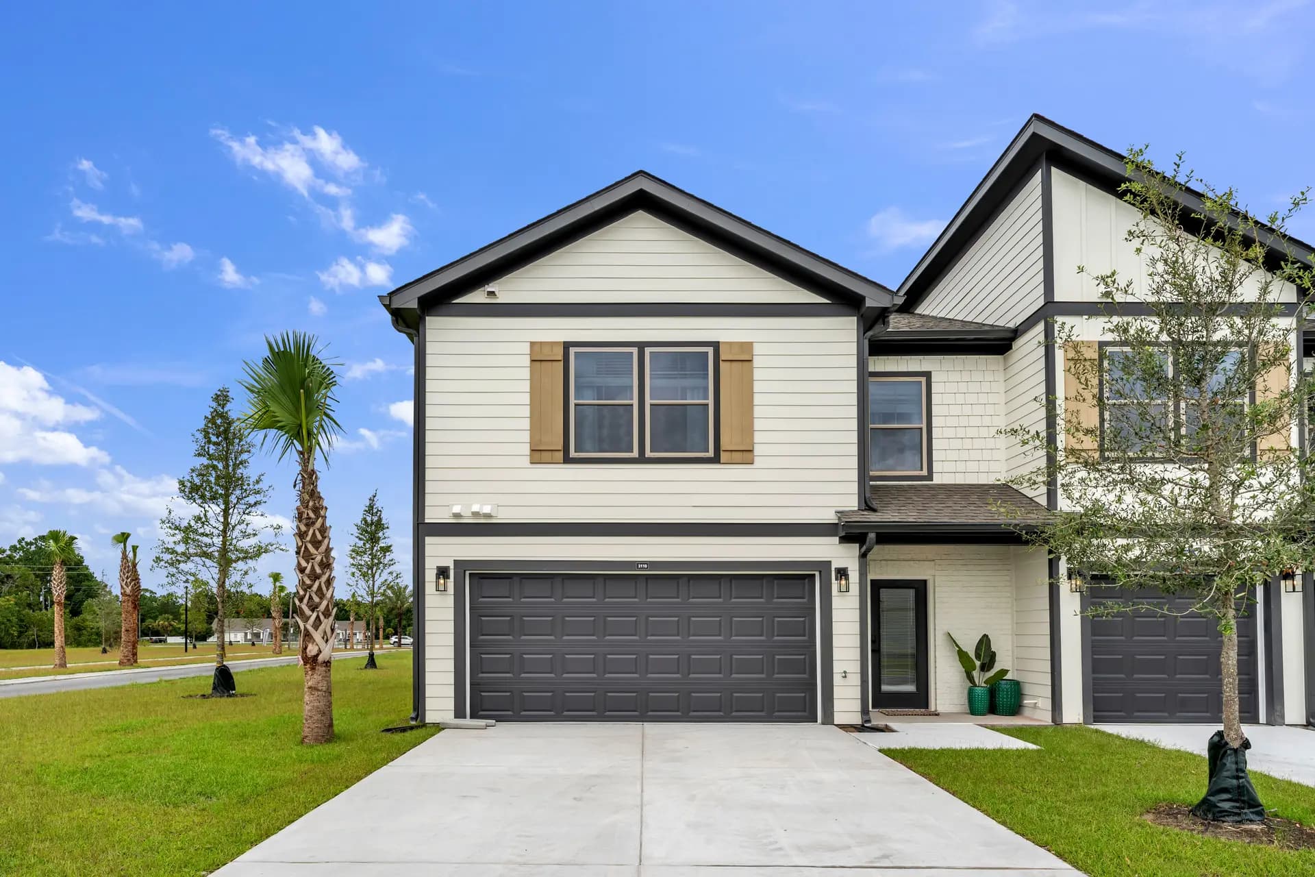 An end-unit townhome at Pointe Villas Bergen Woods with a two-car garage