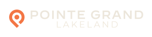 Logo for Pointe Grand Lakeland with an orange location pin icon on the left and text on the right.