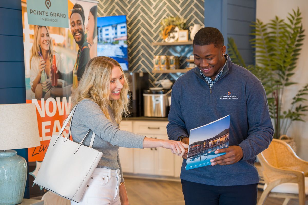 Pointe Grand Leasing Agent answering questions for future resident.
